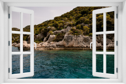 Fototapeta Naklejka Na Ścianę Okno 3D - magnificent view of rocks with green trees and clear turquoise water of the Mediterranean Sea
