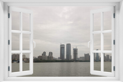 Fototapeta Naklejka Na Ścianę Okno 3D - View of the Modern skyscrapers on the shore of Xiang River. Skyline view. Business district. CBD, downtown. Changsha. Hunan. China. Asia