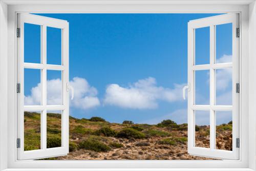 Fototapeta Naklejka Na Ścianę Okno 3D - Steppe Greece terrain landscape with scenic cloudscape on blue vivid sky. Natural south Europe rocky bushy view