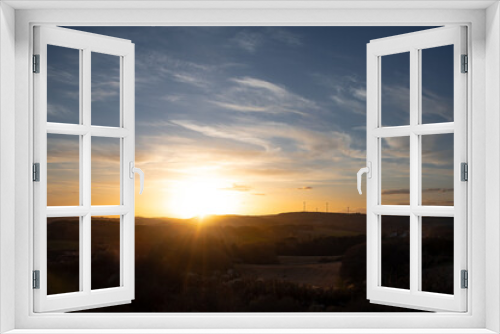 Fototapeta Naklejka Na Ścianę Okno 3D - Sonnenuntergang mit blauem Himmel