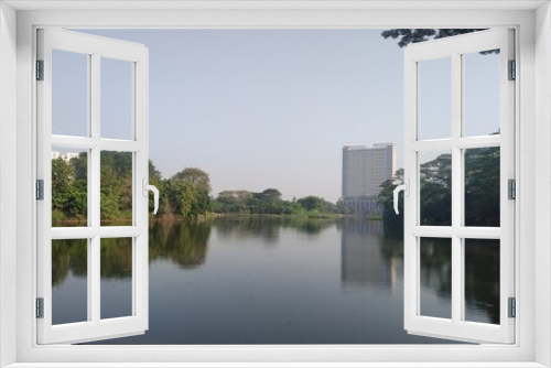Fototapeta Naklejka Na Ścianę Okno 3D - View of Lake and Building 