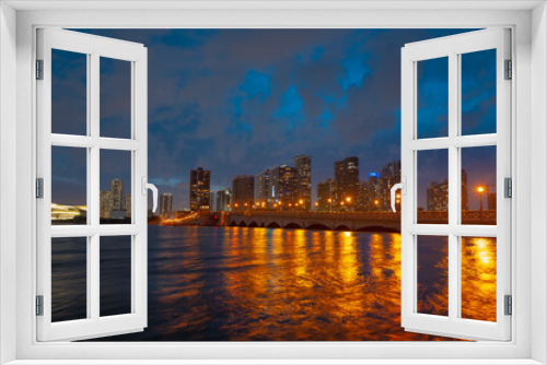 Fototapeta Naklejka Na Ścianę Okno 3D - City of Miami Florida, sunset panorama with business and residential buildings and bridge on Biscayne Bay. Skyline night view.