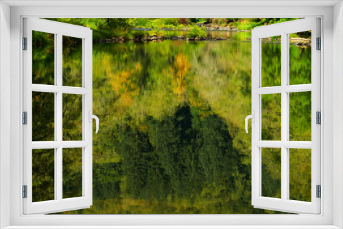 Fototapeta Naklejka Na Ścianę Okno 3D - Reflection of the autumn forest in the calm mountain river.