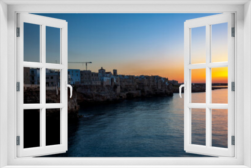 Fototapeta Naklejka Na Ścianę Okno 3D - Sunset in Polignano a mare, in Bari in Puglia, a village by the sea