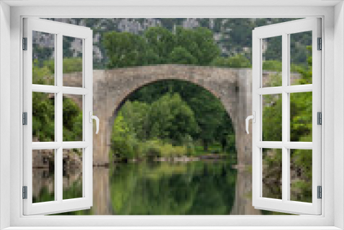 Fototapeta Naklejka Na Ścianę Okno 3D - View of the river Herault in the South of France with the bridge of Saint Etienne d'Issensac in the background