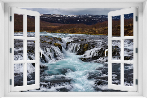 Fototapeta Naklejka Na Ścianę Okno 3D - Bruarfoss waterfall in Iceland showing it's true blue colors on a cold spring day