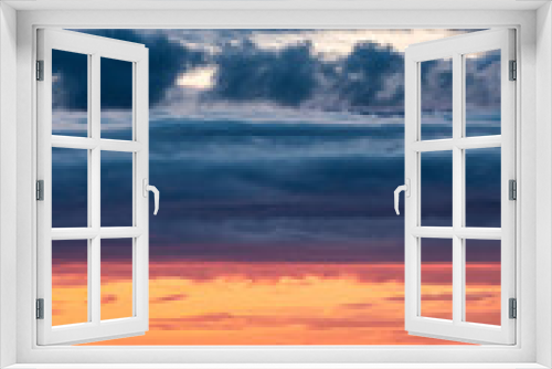 Fototapeta Naklejka Na Ścianę Okno 3D - Sunset over a an overcast mountain range and ocean