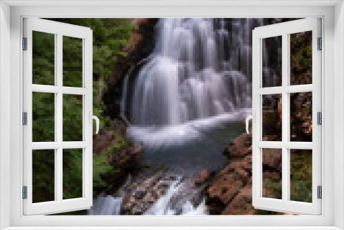 Fototapeta Naklejka Na Ścianę Okno 3D - Magical waterfalls in the middle of a forest