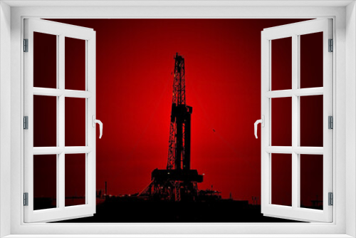 Fototapeta Naklejka Na Ścianę Okno 3D - The drilling rig during sunset