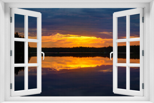 Fototapeta Naklejka Na Ścianę Okno 3D - Scenic and beautiful sunset and colorful cloudy sky and their reflections on a lake in Finland at summer.