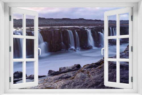 Fototapeta Naklejka Na Ścianę Okno 3D - A magnificent view of the numerous streams of waterfalls flowing down to the river at the Dettifoss, Iceland