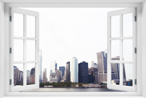 Fototapeta Naklejka Na Ścianę Okno 3D - USA, NEW YORK: Scenic cityscape of Lower Manhattan skyscrapers from the water 