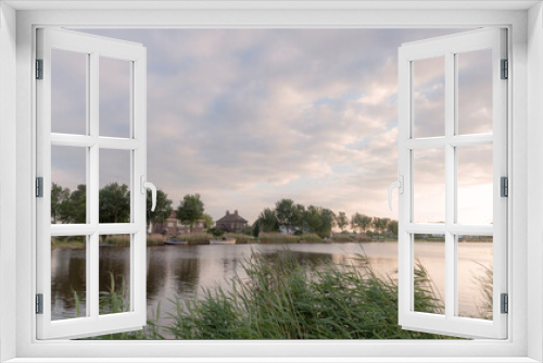 Fototapeta Naklejka Na Ścianę Okno 3D - Rural landscape of the Amstel river at the golden hour