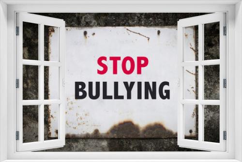 Fototapeta Naklejka Na Ścianę Okno 3D - Stop Bullying, words on a grunge metal board on wall.