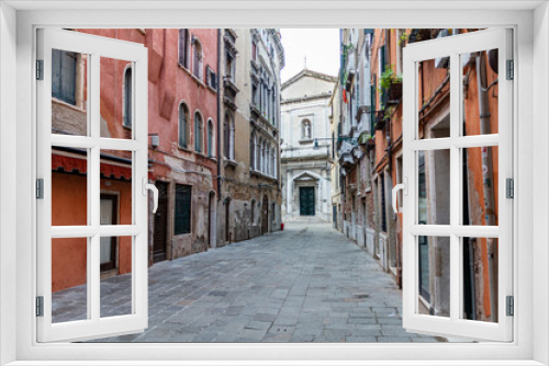 Fototapeta Naklejka Na Ścianę Okno 3D - Empty narrow street in Venice, Italy