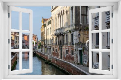 Fototapeta Naklejka Na Ścianę Okno 3D - Romanic view of a Water Canal (so-called Riva) in Venice, Italy. These waterways are the main means of transport in the city