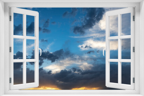 Blue sunset sky with dramatic clouds. Sky background after sunset.