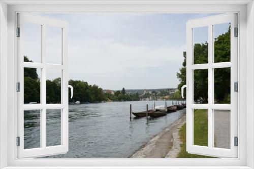 Fototapeta Naklejka Na Ścianę Okno 3D - Promenade along Rhine river in Schaffhausen, Switzerland. There are wooden boats moored along the river bank. They are called weidling boot in German language and they are traditional Swiss boats.