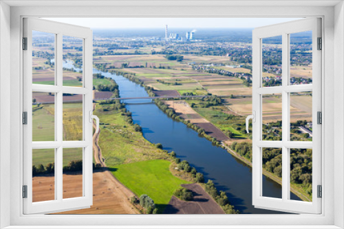 Fototapeta Naklejka Na Ścianę Okno 3D - aerial view of power plant , river and harvest  fields