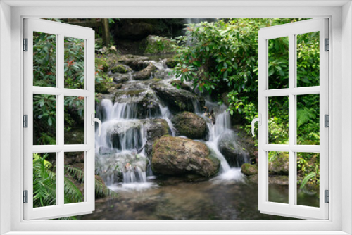 Fototapeta Naklejka Na Ścianę Okno 3D - Glistening waterfall at Rainvow Springs  in a tropical environment