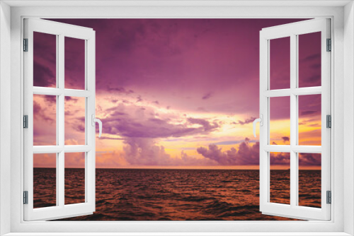 Fototapeta Naklejka Na Ścianę Okno 3D - Nature in twilight period which including of sunrise over the sea and the nice beach. Summer beach with blue water and purple sky at the sunset.	
