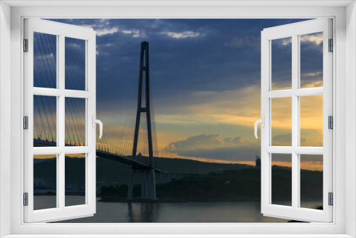 Fototapeta Naklejka Na Ścianę Okno 3D - Russian bridge across the Eastern Bosphorus Strait in Vladivostok. Russian bridge to the Russky island against the background of a bright dawn.