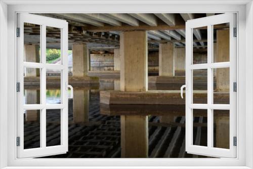 Fototapeta Naklejka Na Ścianę Okno 3D - Under the car bridge across the river