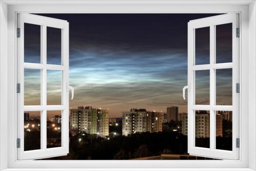 Fototapeta Naklejka Na Ścianę Okno 3D - Noctilucent clouds in the night city sky