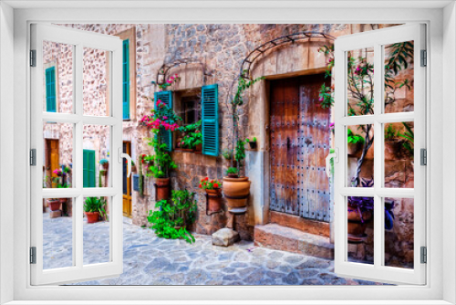 Fototapeta Naklejka Na Ścianę Okno 3D - Beautiful floral streets with old doors and windows. Mediterranean culture and traditional villages