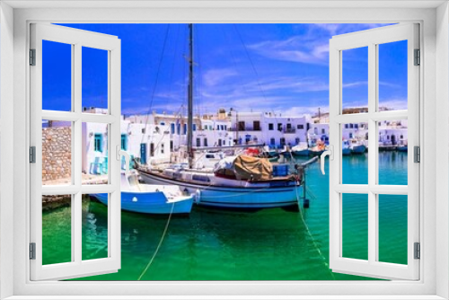 Fototapeta Naklejka Na Ścianę Okno 3D - Greece travel. Cyclades, Paros island. Charming fishing village Naousa. view of old port with  boats and street taverns by the sea.