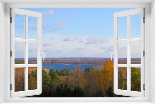 Fototapeta Naklejka Na Ścianę Okno 3D - View from the height of the lake and forest in autumn.
