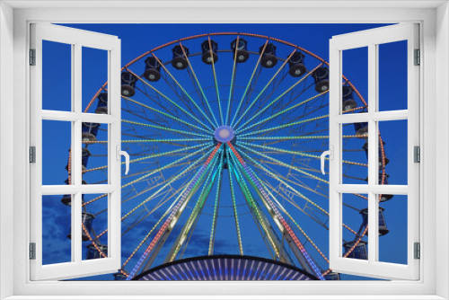 Fototapeta Naklejka Na Ścianę Okno 3D - High Ferris Wheel against dark night sky in our summer vacation at Adriatic seaside. Amusement park ride. Holidays concept.