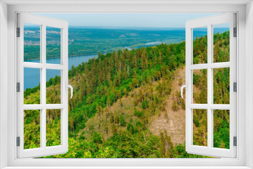 Fototapeta Naklejka Na Ścianę Okno 3D - Panorama of mountains with a dense forest and the Volga River on the background, photographed from a height. Nature of Russia