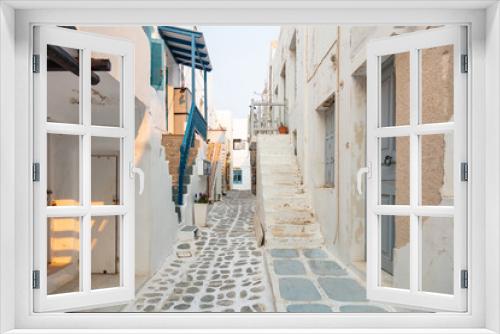 Fototapeta Naklejka Na Ścianę Okno 3D - Paros island, Greece. Whitewashed buildings, narrow cobblestone streets