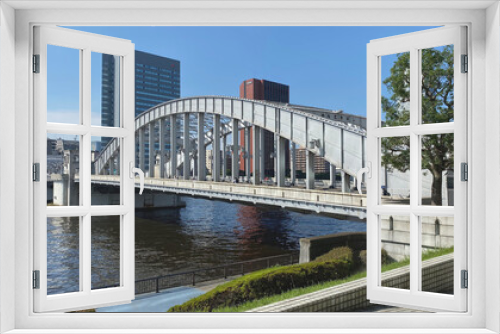 Fototapeta Naklejka Na Ścianę Okno 3D - Kachidoki Bridge. The famous historical bridge on Sumida River. Japan Tokyo 21 June 2021