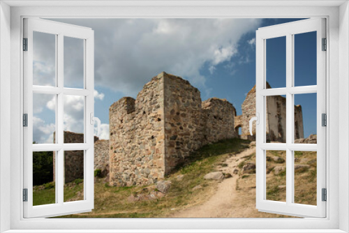 Fototapeta Naklejka Na Ścianę Okno 3D - Ruins of an old castle against a blue sky
