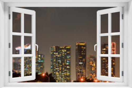 Fototapeta Naklejka Na Ścianę Okno 3D - city skyline at night Miami Florida buildings sea sky water panorama hotel apartments 