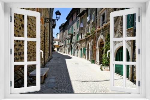 Fototapeta Naklejka Na Ścianę Okno 3D - Carpineto Romano, Italy, July 24, 2021. A street in the historic center of a medieval town in the Lazio region.