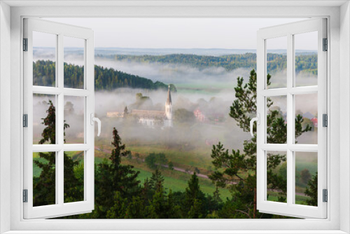 Fototapeta Naklejka Na Ścianę Okno 3D - Church lying in misty landscape