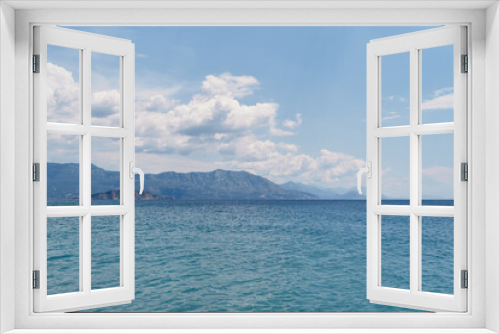Fototapeta Naklejka Na Ścianę Okno 3D - View from the sea to the mountains and the island against the background of blue sky