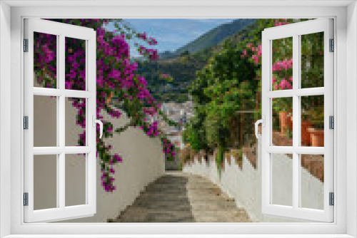 Fototapeta Naklejka Na Ścianę Okno 3D - view of a street in Frigiliana, pueblo blanco, typical spanish village architecture in southern part of the country
