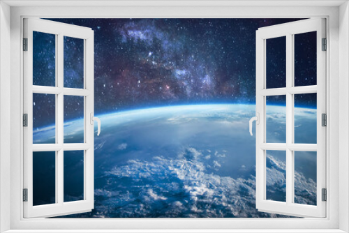 Fototapeta Naklejka Na Ścianę Okno 3D - Earth in the outer space. Orbit of planet. Sun light and stars on background. Milky way. Elements of this image furnished by NASA