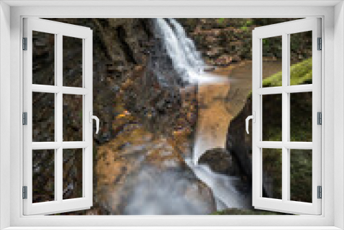 Fototapeta Naklejka Na Ścianę Okno 3D - water flowing into a creek with a waterfall