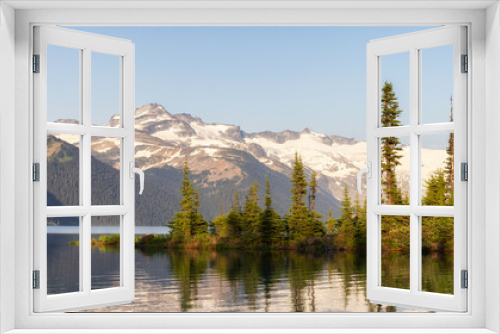 Fototapeta Naklejka Na Ścianę Okno 3D - View of Canadian Nature Landscape with rocky islands and mountains in the background. Garibaldi Lake, Near Whistler and Squamish, North of Vancouver, British Columbia, Canada. Sunny Summer