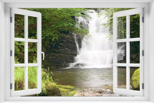 Fototapeta Naklejka Na Ścianę Okno 3D - The waterfall on Hoar Oak Water just before it flows into the East Lyn River at Watersmeet, near Lynmouth, Exmoor, Devon