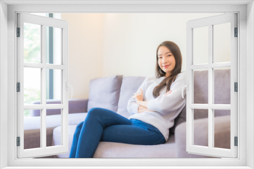 Portrait beautiful young asian woman relax smile on sofa