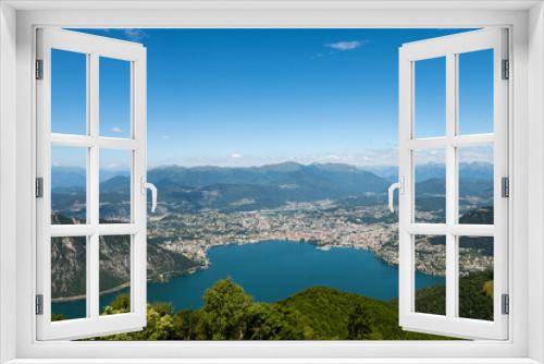 Fototapeta Naklejka Na Ścianę Okno 3D - Gorgeous view from the hill top at Balcony of Italy, over Lake Lugano, city Lugano and other cities. The view go far into Switzerland, all to the way to the Swiss alps. Shot from the Italian side of t
