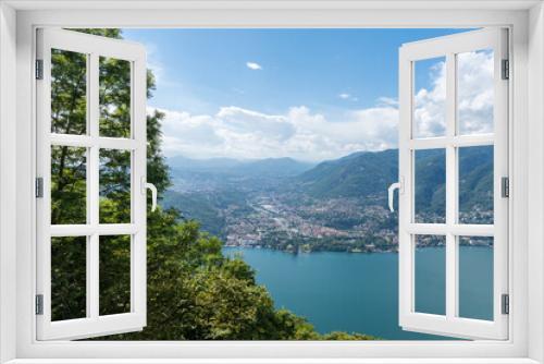 Fototapeta Naklejka Na Ścianę Okno 3D - Beautiful view over Lake Como and the city of Tavernola, Lombardy, Italy. The view is seen from the small village of Brunate, above the city of Como. It is a sunny, summer day