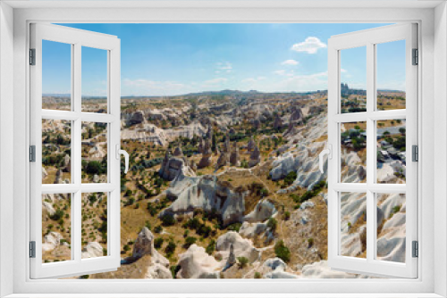 Fototapeta Naklejka Na Ścianę Okno 3D - Aerial View of Goreme valley in Turkey. Panorama of Cappadocia - wide angel landscape mountain peaks of ancient cave town Uchisar.