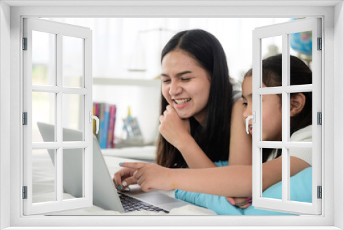 young woman talking with video conference at home, online remote communication technology to call by laptop computer on cyberspace, lifestyle of female person happy to work and keep distant isolated